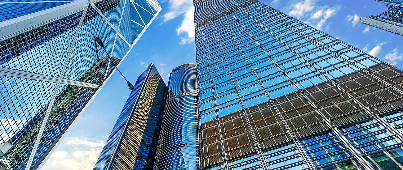 a low angle view of tall buildings in Hong Kong