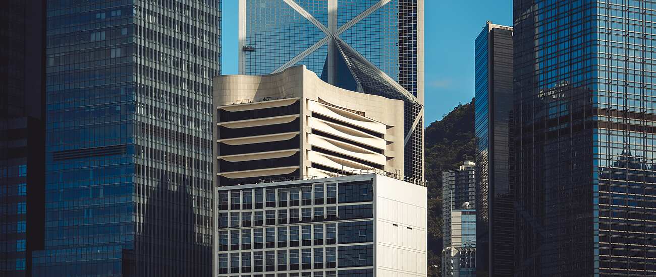 a group of tall buildings in Hong Kong